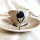 Vintage 23-piece Niderviller coffee set with hand-painted black tulip decor.