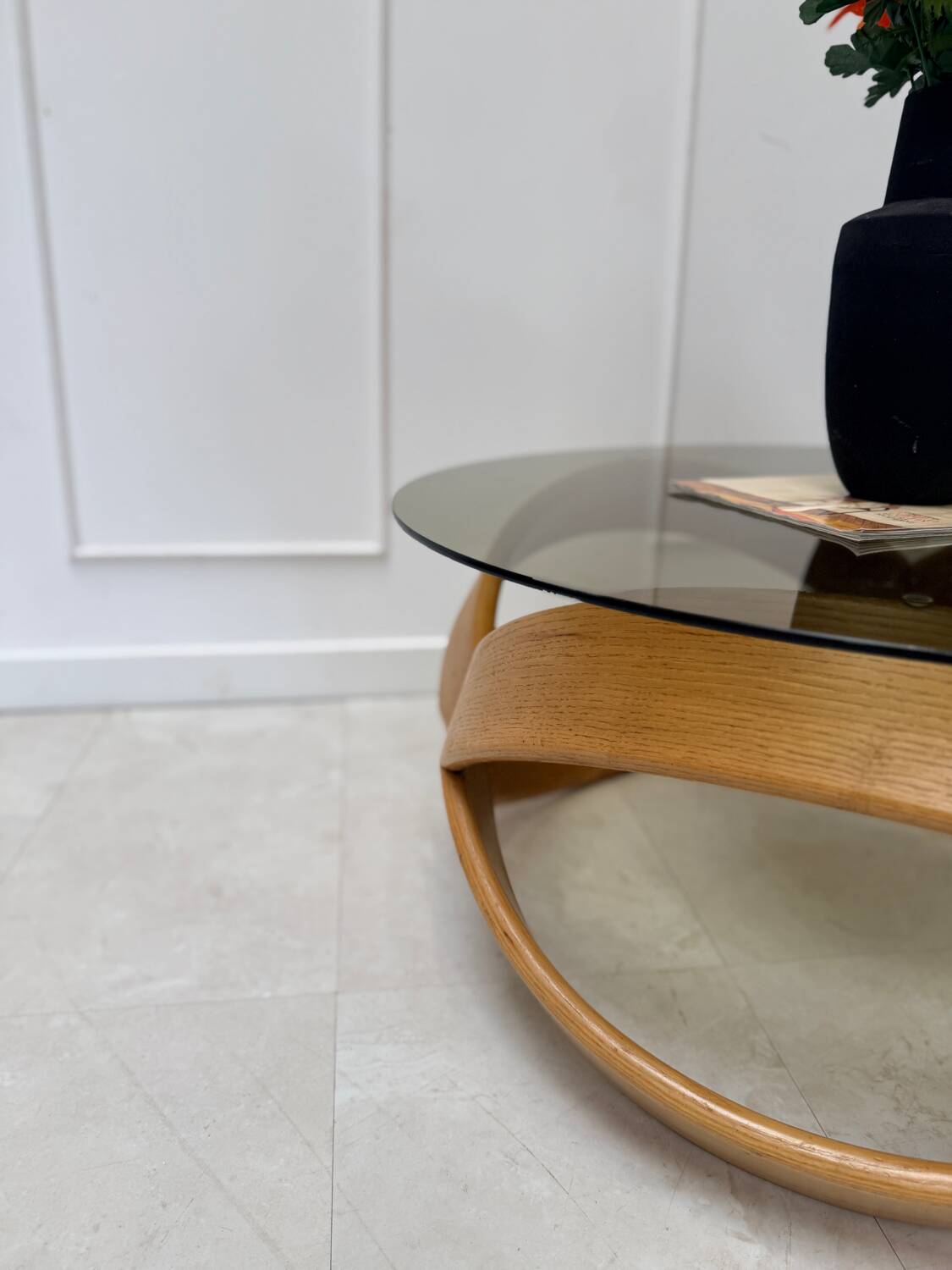 Smoked glass and curved wood coffee table
