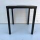 Old black metal and majolica tiles table