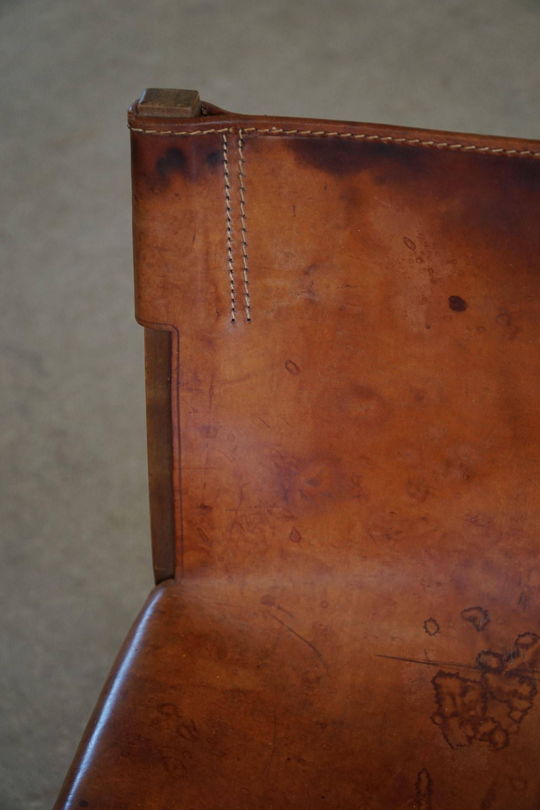 Paco Muñoz, Pair of lounge hunting armchairs, model "Riaza", leather and walnut, 1960