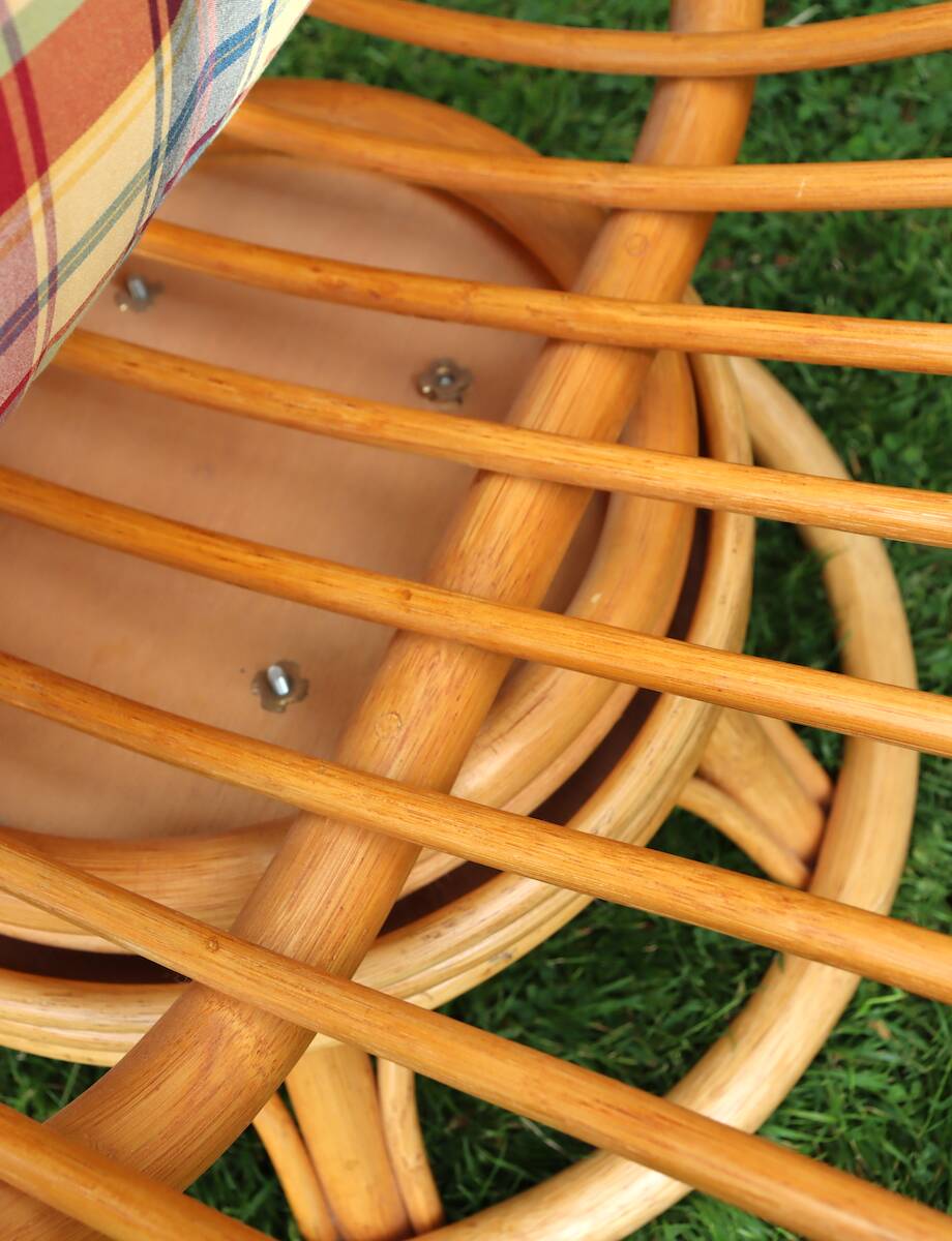 Swivel rattan armchair with matching ottoman