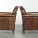 Characterful set of two sheepskin design armchairs with beautiful patina