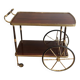 Mahogany and brass rolling table in the style of Maison Jansen.