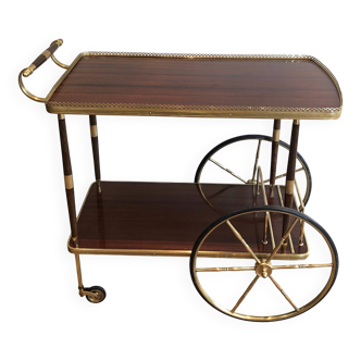 Mahogany and brass rolling table in the style of Maison Jansen.