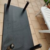 Old vintage wooden coffee table with tubular base