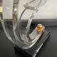 Pair of Hollywood Regency candlesticks in lucite and brass