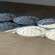 Set of 10 flat plates in Limoges porcelain from France with flowers.
