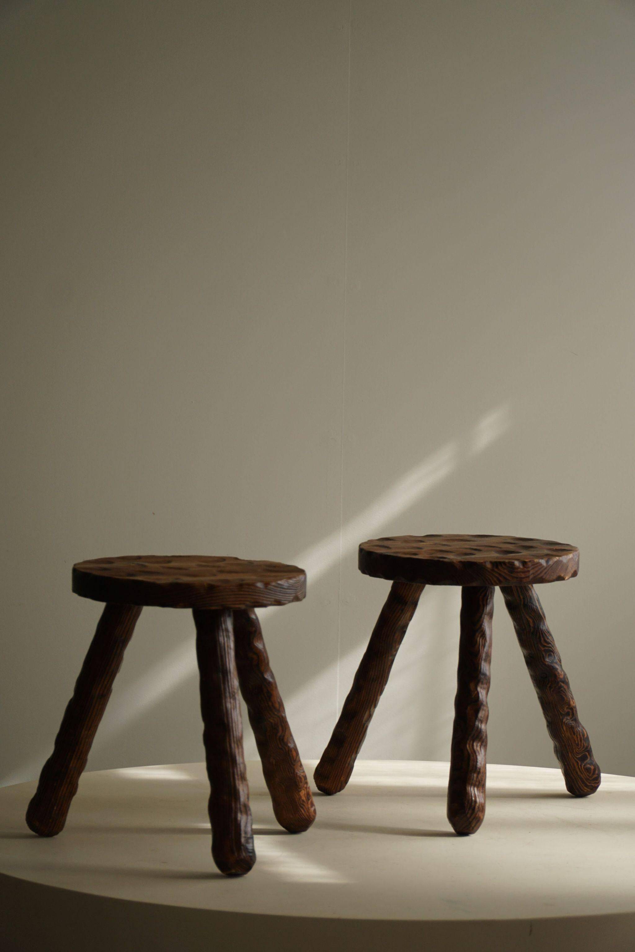 A pair of Wabi Sabi stools carved from pine, mid-century modern Swedish style, 1960s.