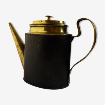 Yellow copper and iron watering can