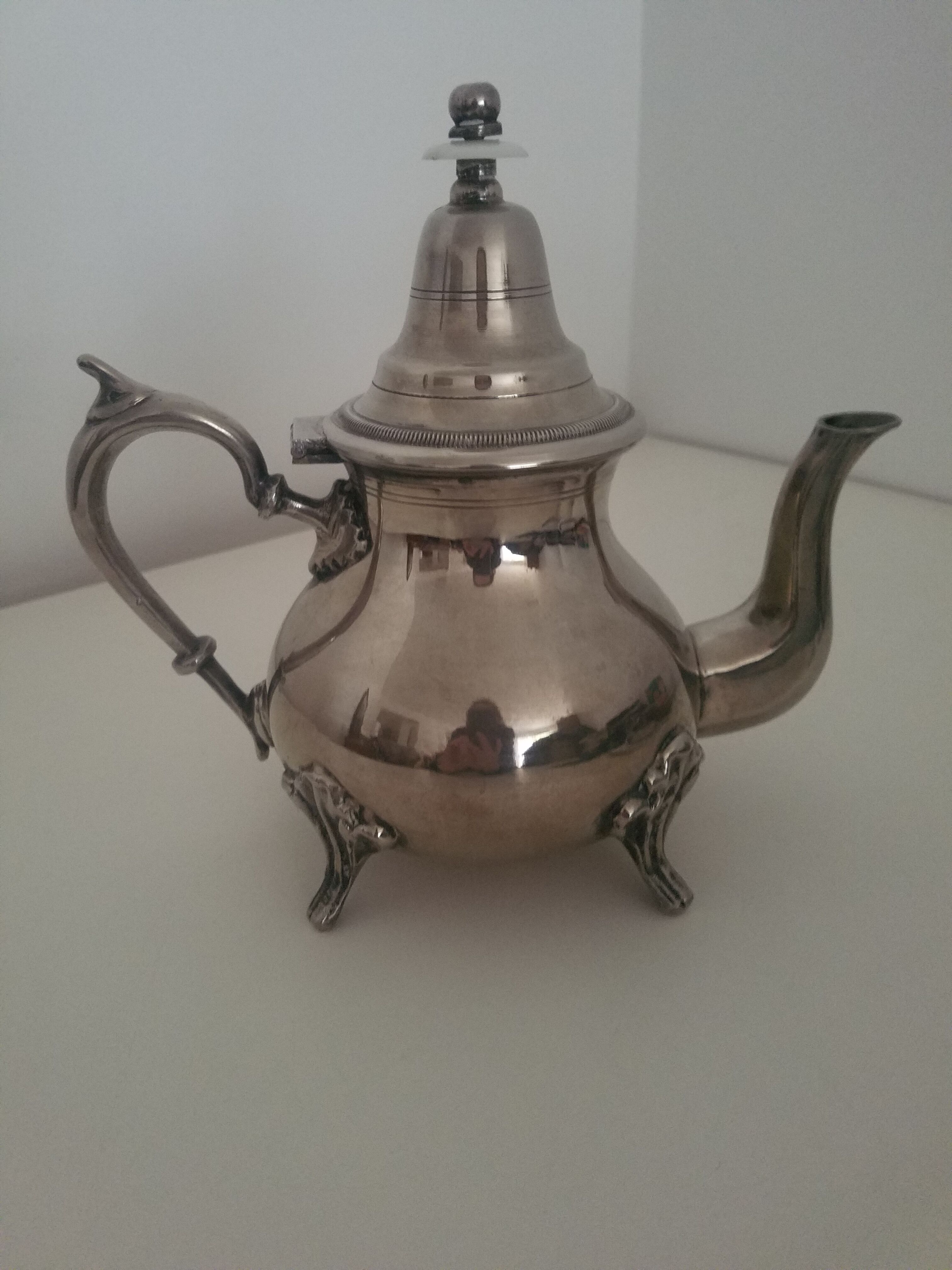 Oriental teapot in silver metal