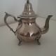 Oriental teapot in silver metal