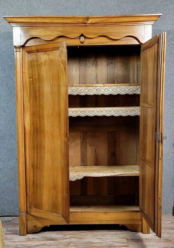 Exceptional Empire period wardrobe in solid walnut, 19th century, circa 1800