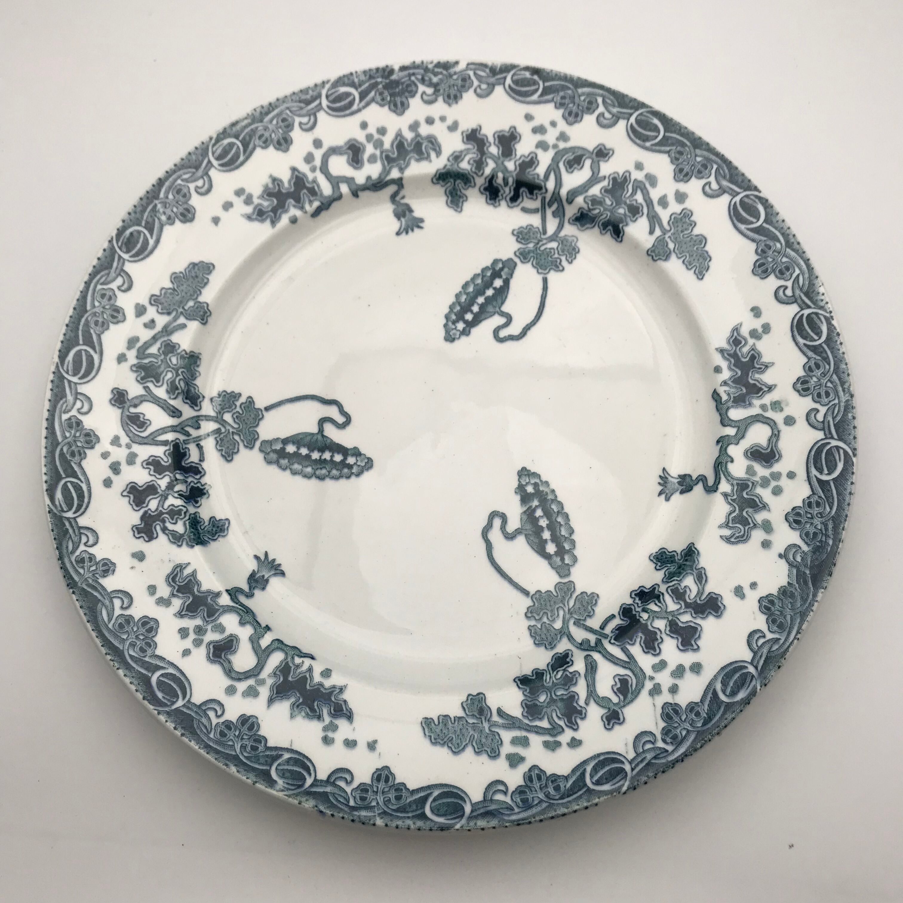 6 mismatched iron land dessert plates