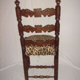 Old chair covered Leopard fabrics