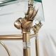 Hollywood Regency brass and glass shelf with elephant heads from the 1970s