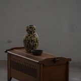 Modern Danish oak commode with decorative relief sculpture, mid-20th century.