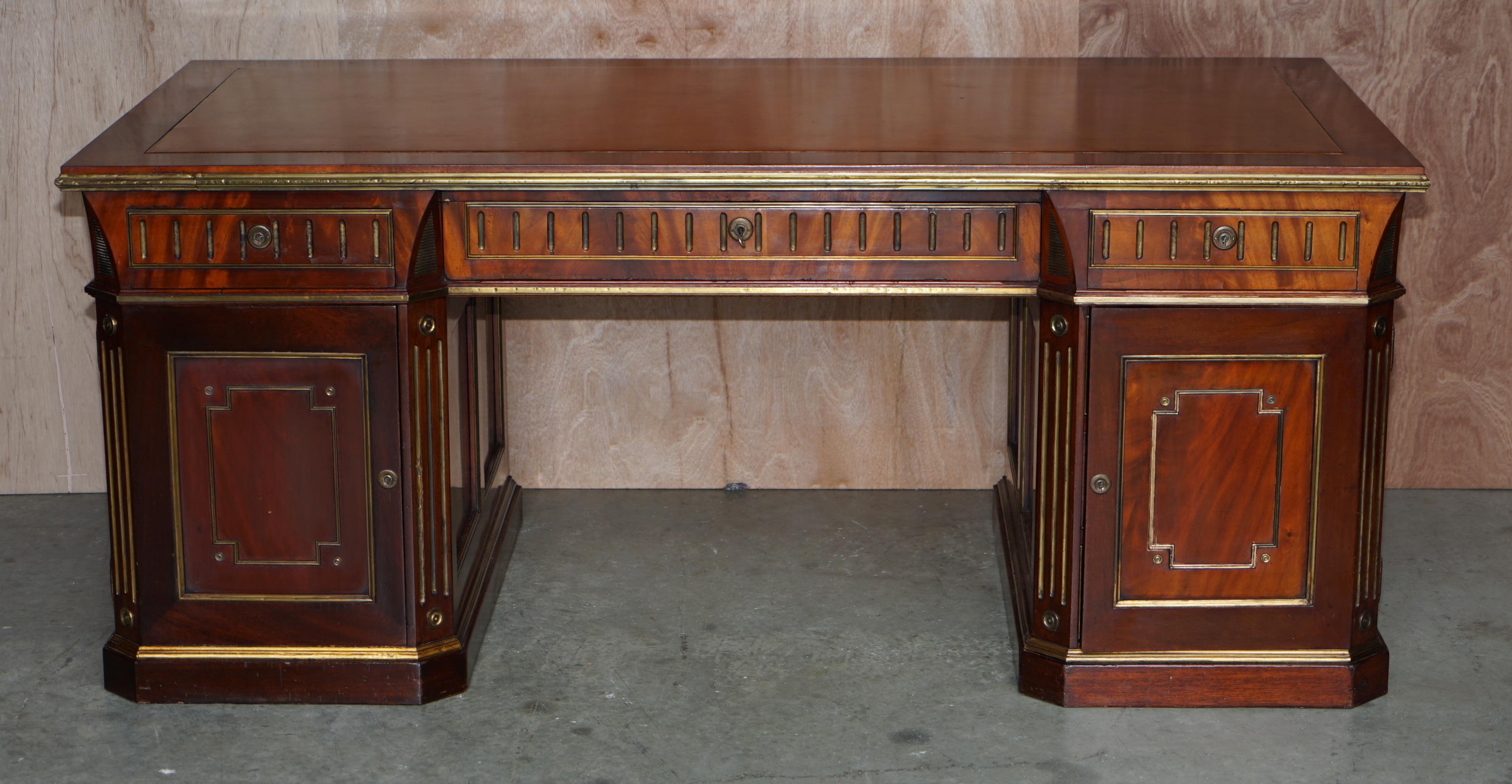 Restored antique Russian hardwood partner desk and leather armchair.
