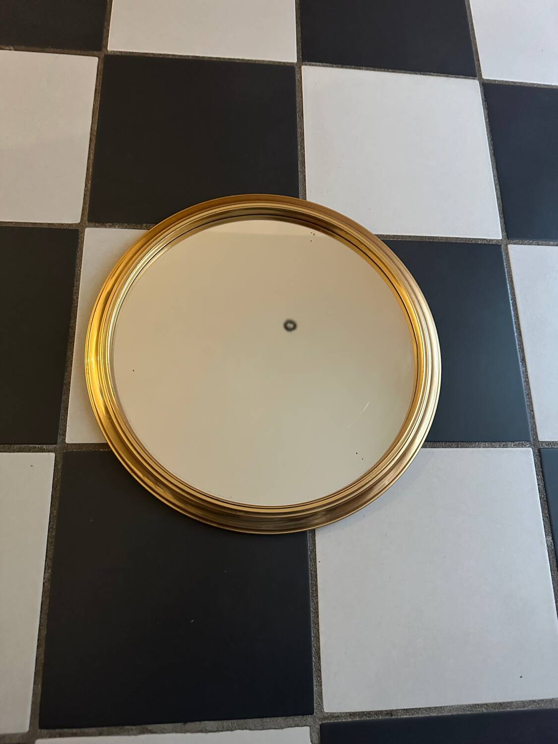 Round golden mirror