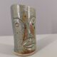 Signed vase in enamelled sandstone with stylized face