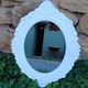 Oval mirror with white frame