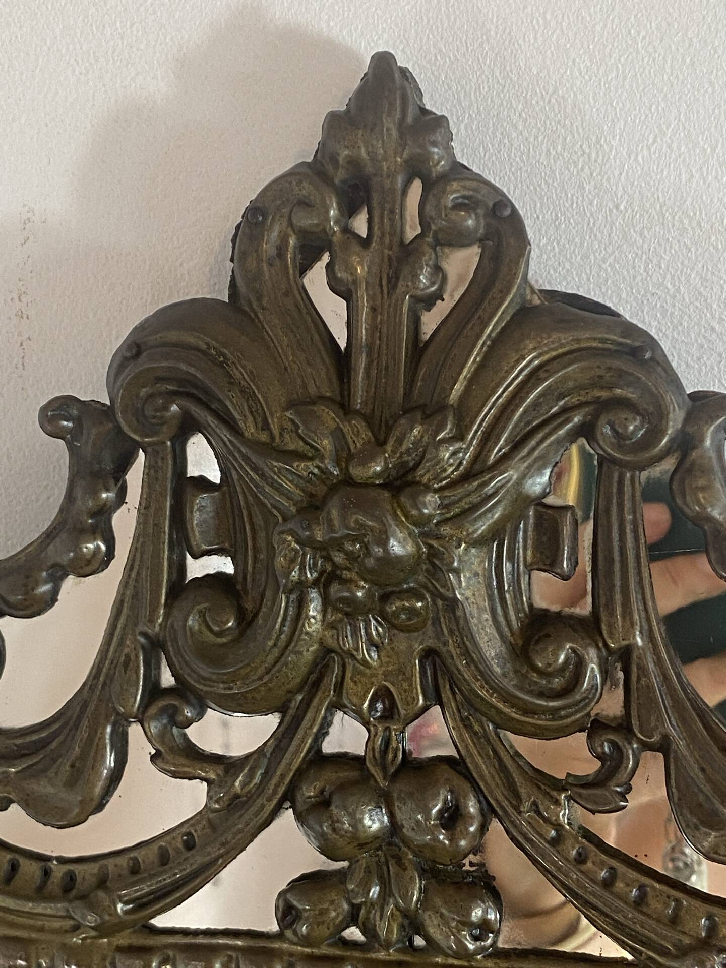 Mirror with brass repoussé frame