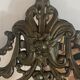 Mirror with brass repoussé frame