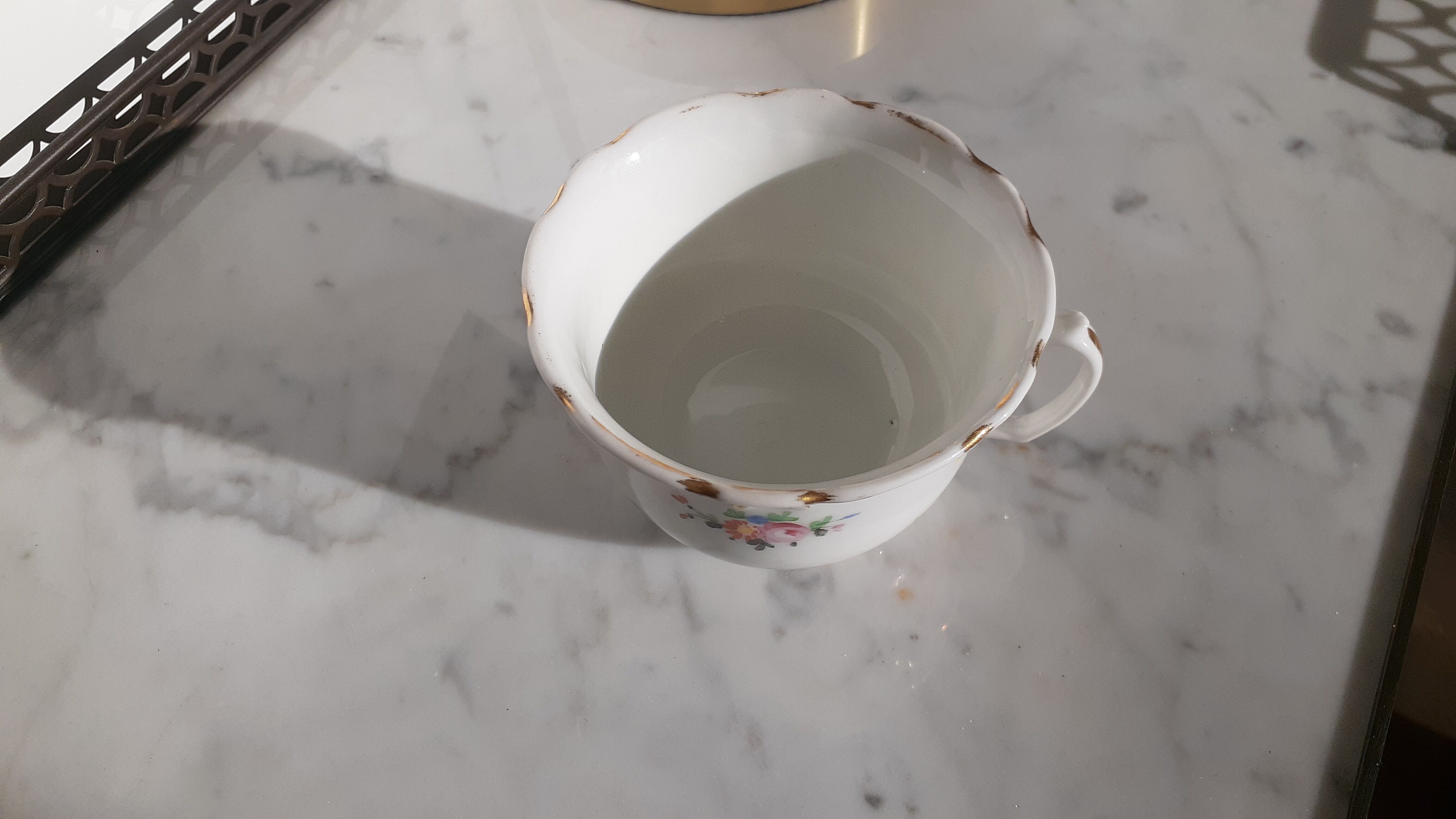 Antique flowered porcelain cup