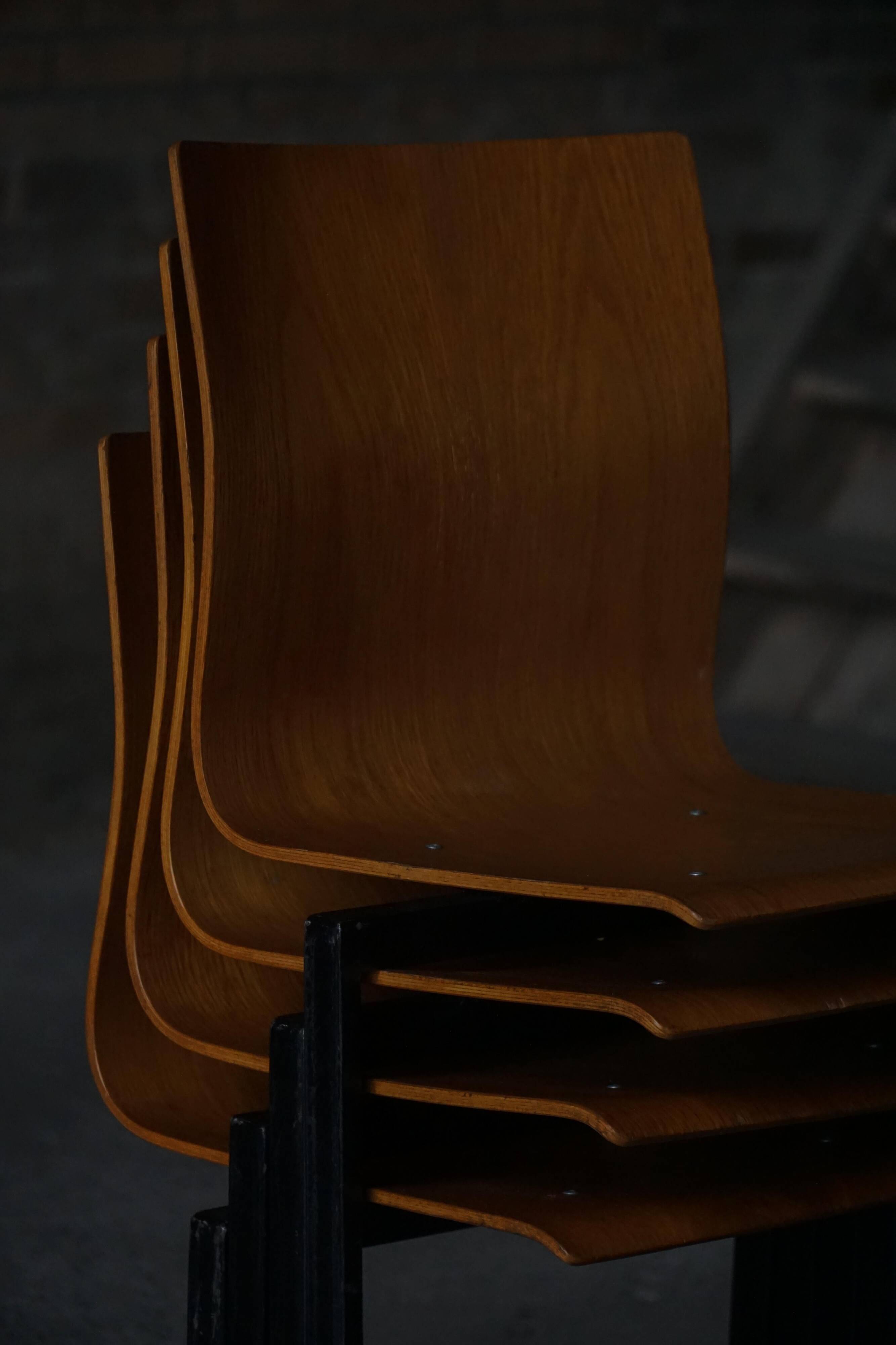 Set of 6 industrial stackable chairs by Niels Larsen, black metal and oak, 1960s.