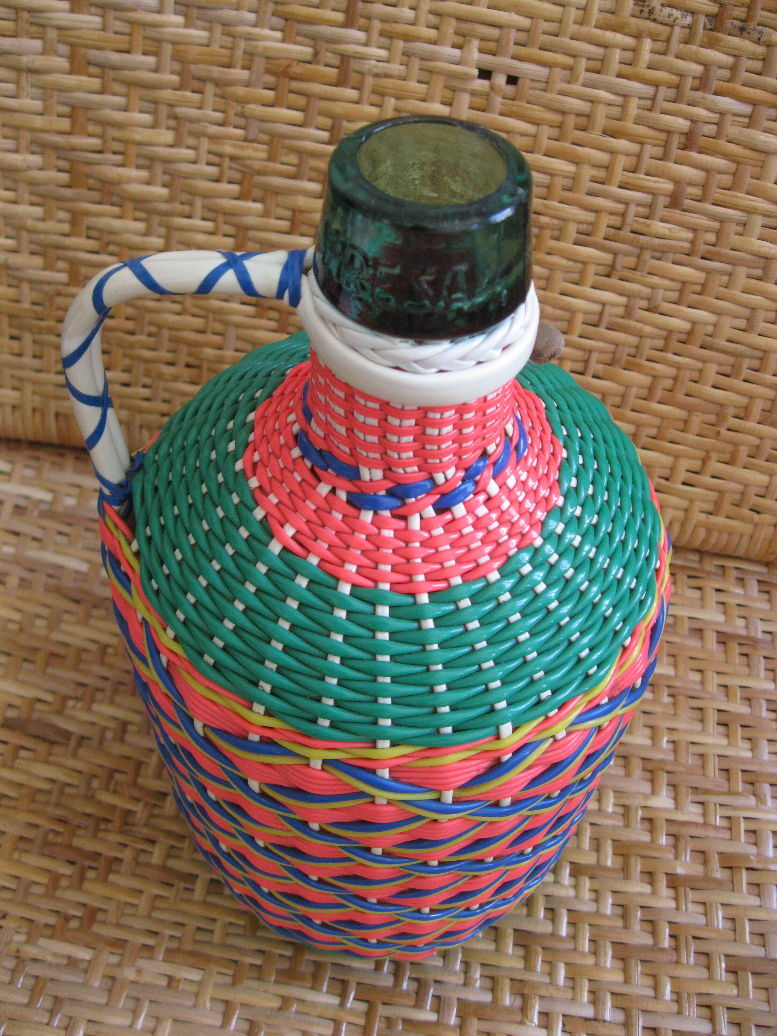 Vintage and multi-coloured demijohn