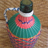 Vintage and multi-coloured demijohn