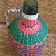 Vintage and multi-coloured demijohn