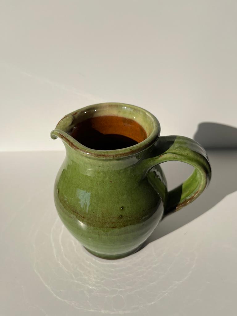 Green glazed ceramic pitcher