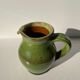 Green glazed ceramic pitcher