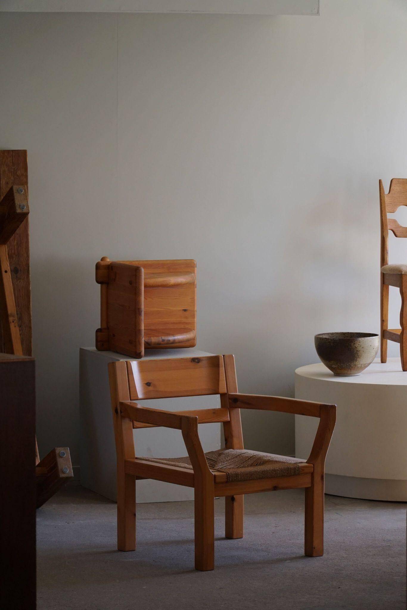 Tage Poulsen, a pair of brutalist chairs in pine and cord, Danish modern style, 1970s.