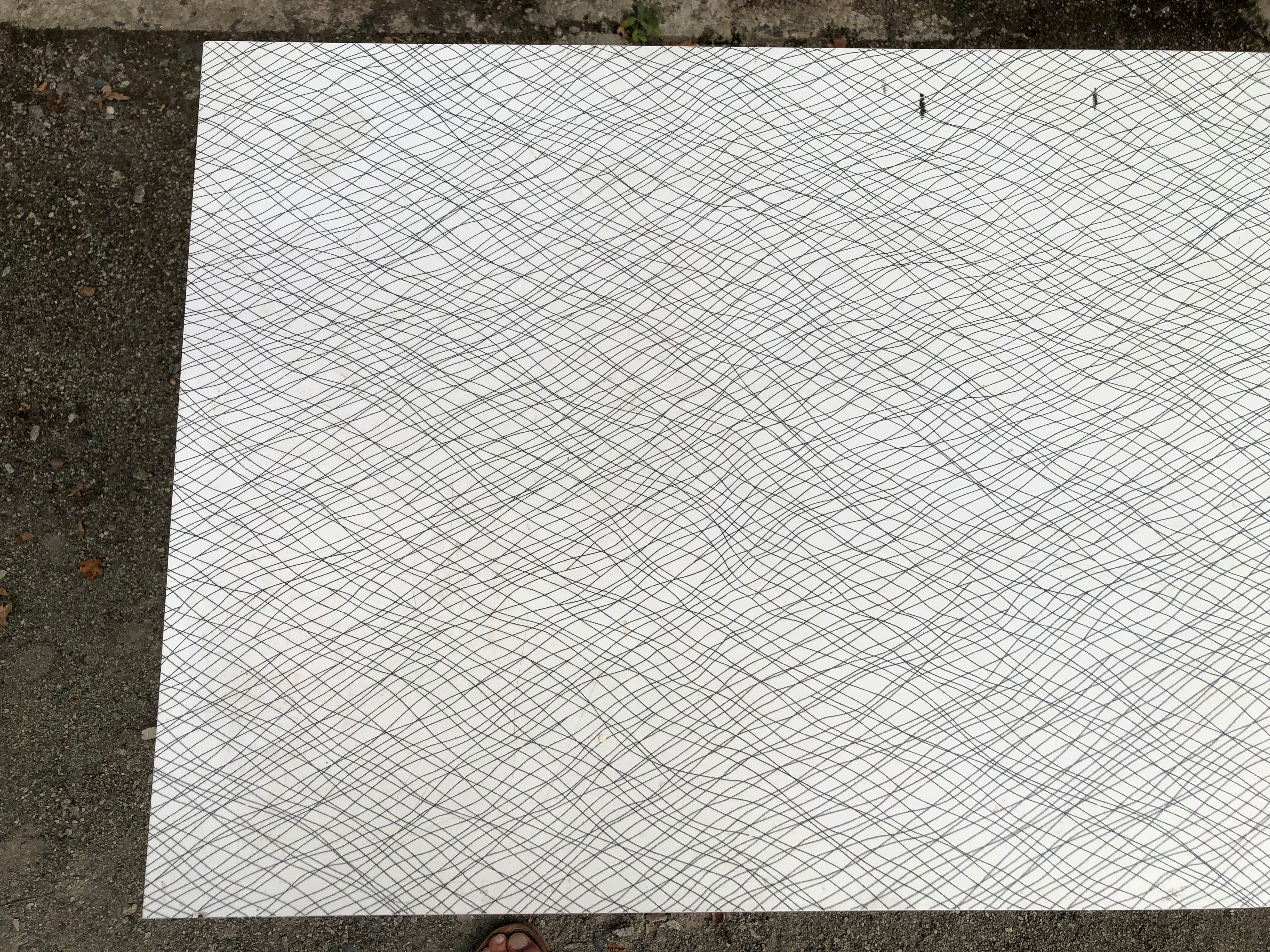 Vintage bistro table with an Art Deco style cast iron base and Formica top.