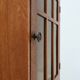 Art Deco oak wall cabinet with amber glazed door, Belgium ca. 1925