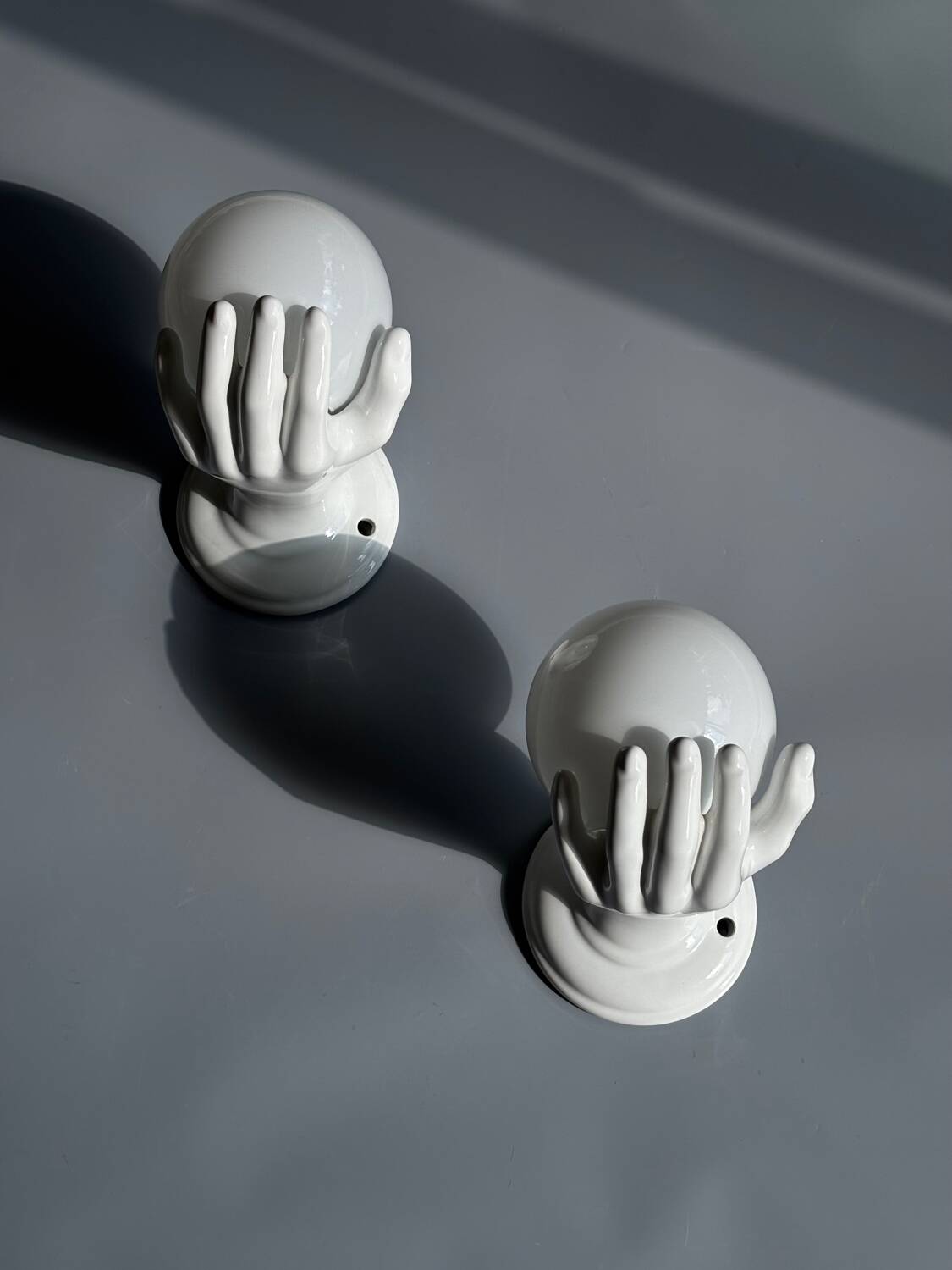 Pair of opaline and ceramic hand sconces