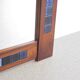 Rosewood mirror with blue ceramic tiles