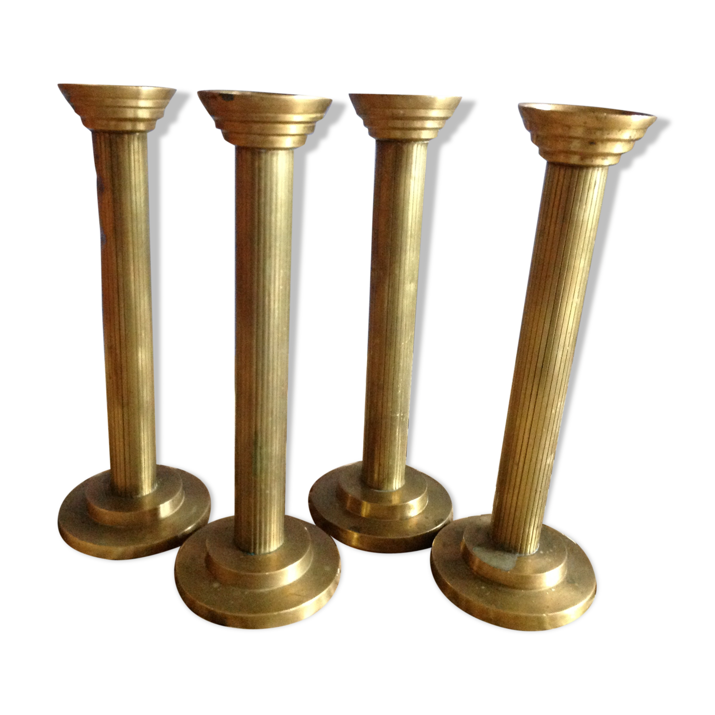 Series of 4 brass candlesticks