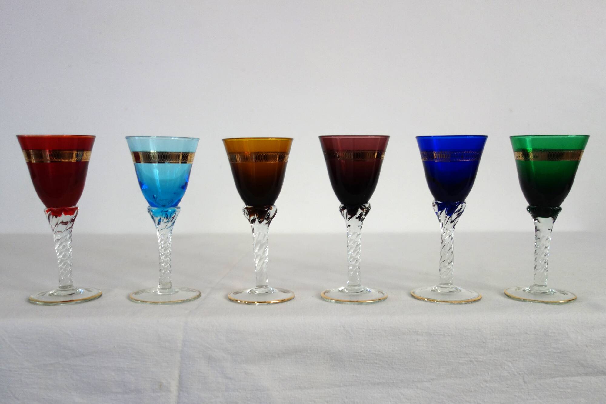 6 multicolored aperitif glasses with twisted legs