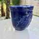 Wall pot in glazed blue terracotta with a grape motif, 1970s.
