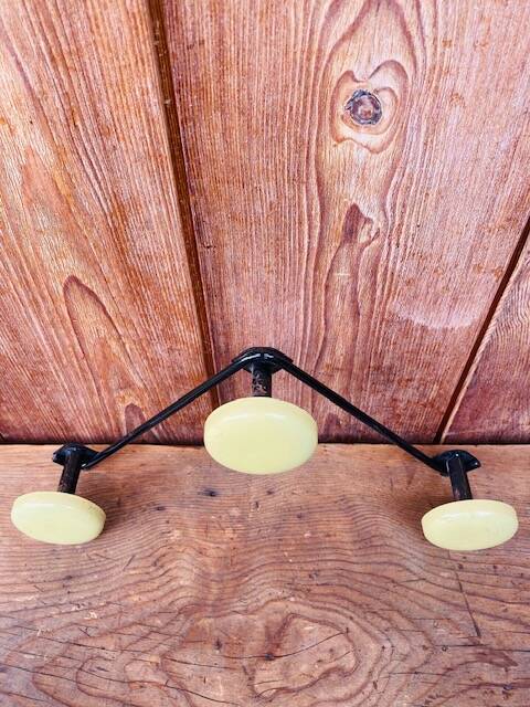Vintage yellow wall coat rack