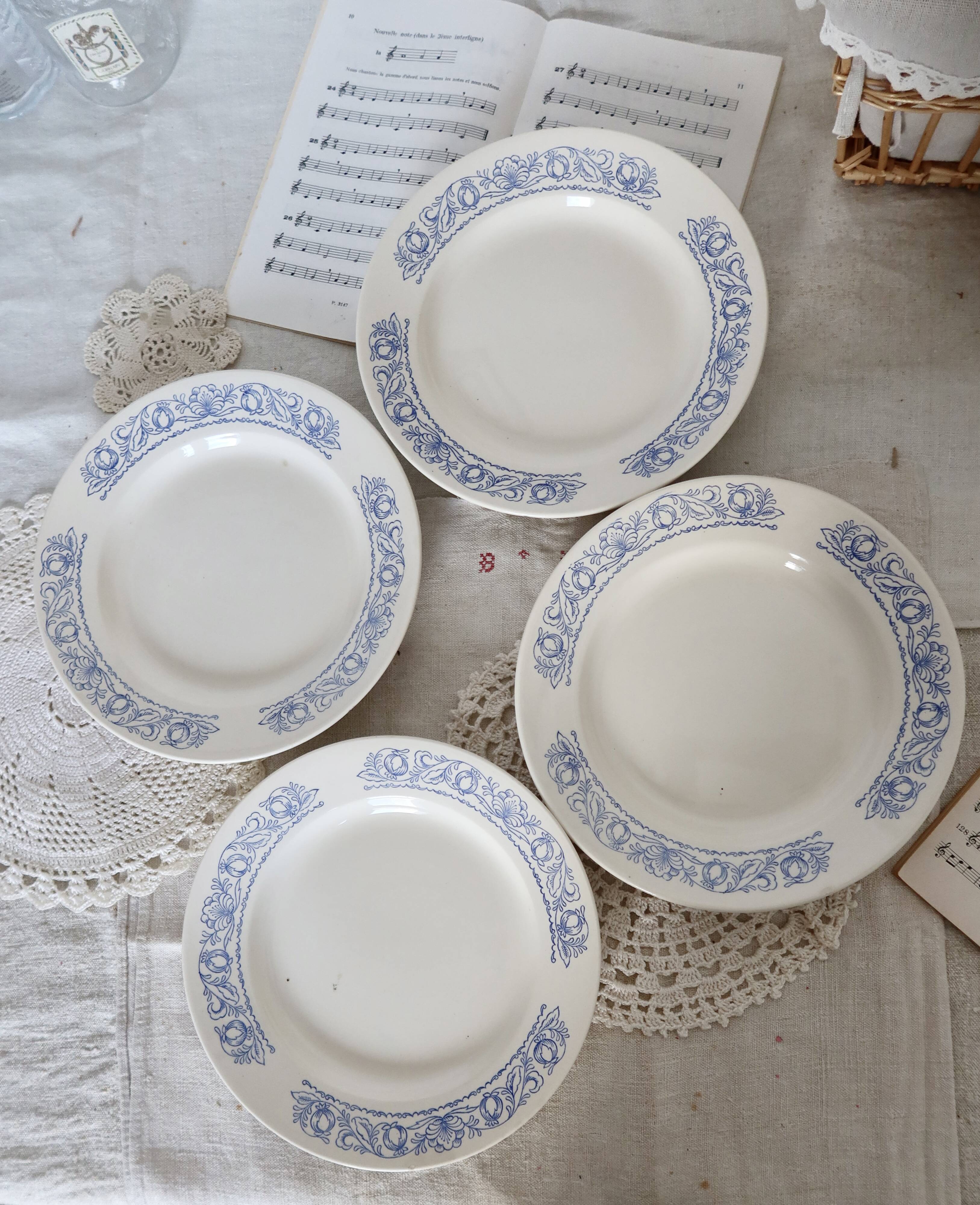 4 vintage white soup plates with blue border