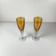 Yellow colored crystal champagne coupe duo
