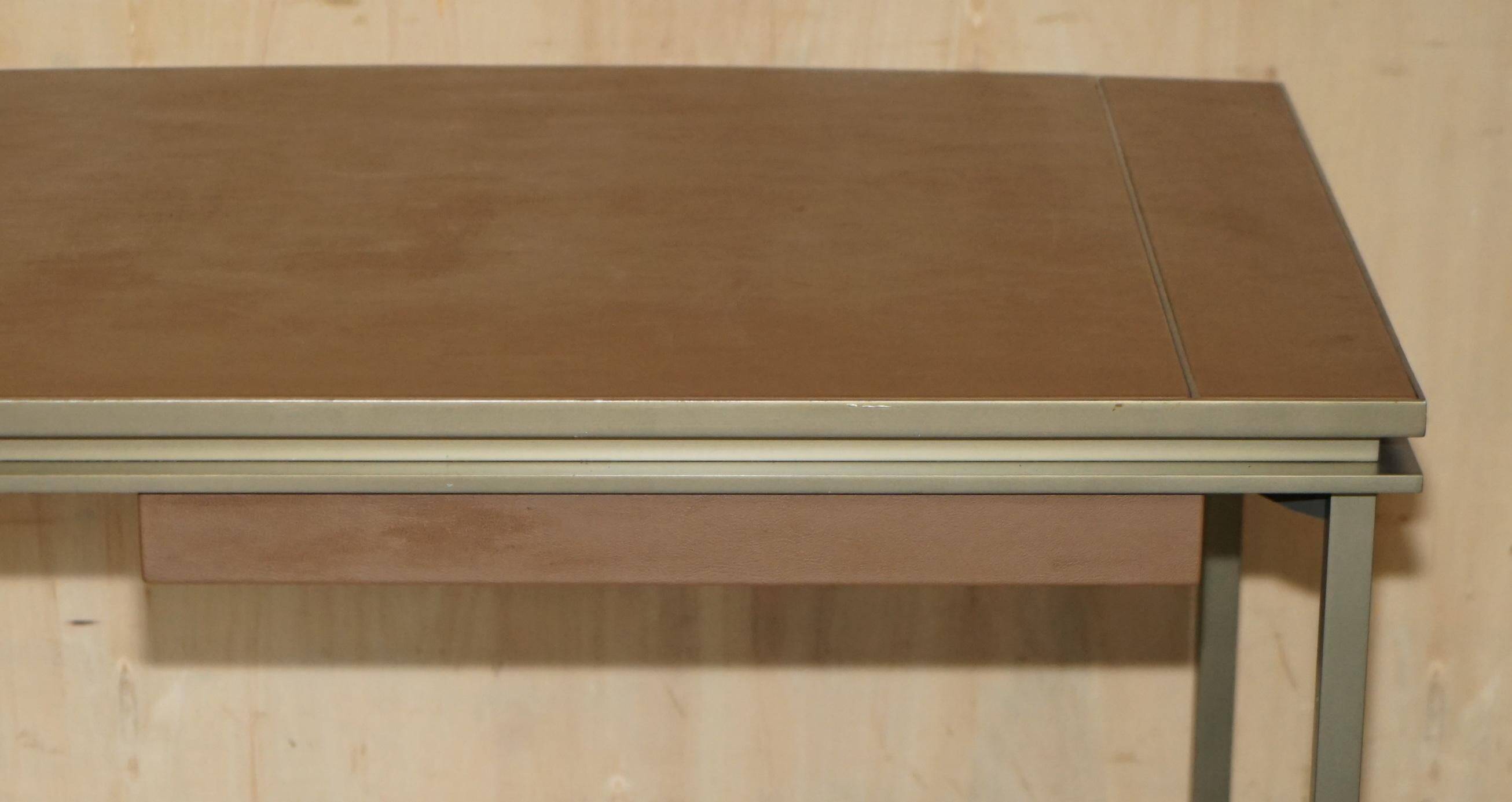 Modern mid-century writing desk signed Cartier in bronze and leather.