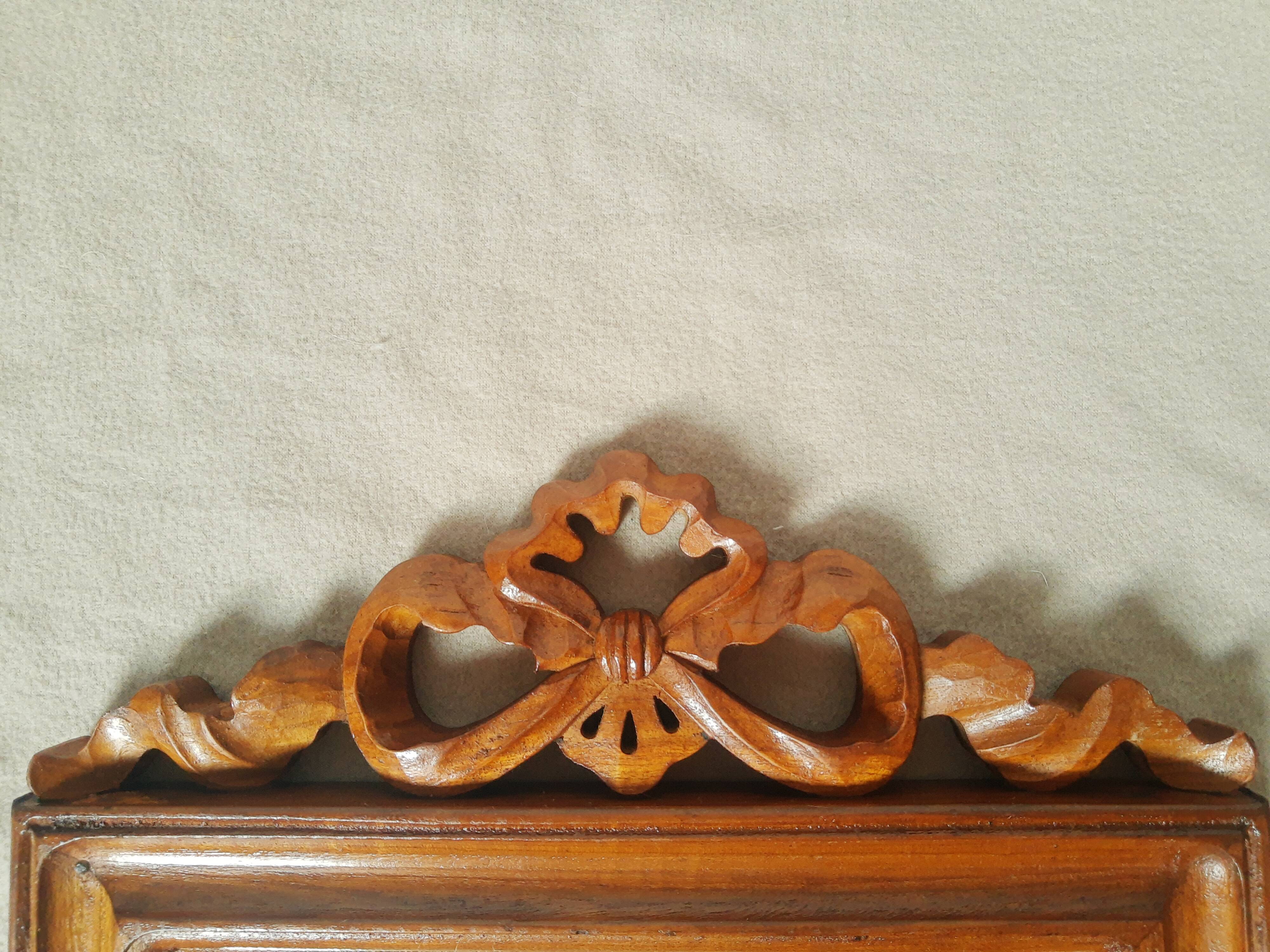 Wooden hanging mirror with vintage carved knot