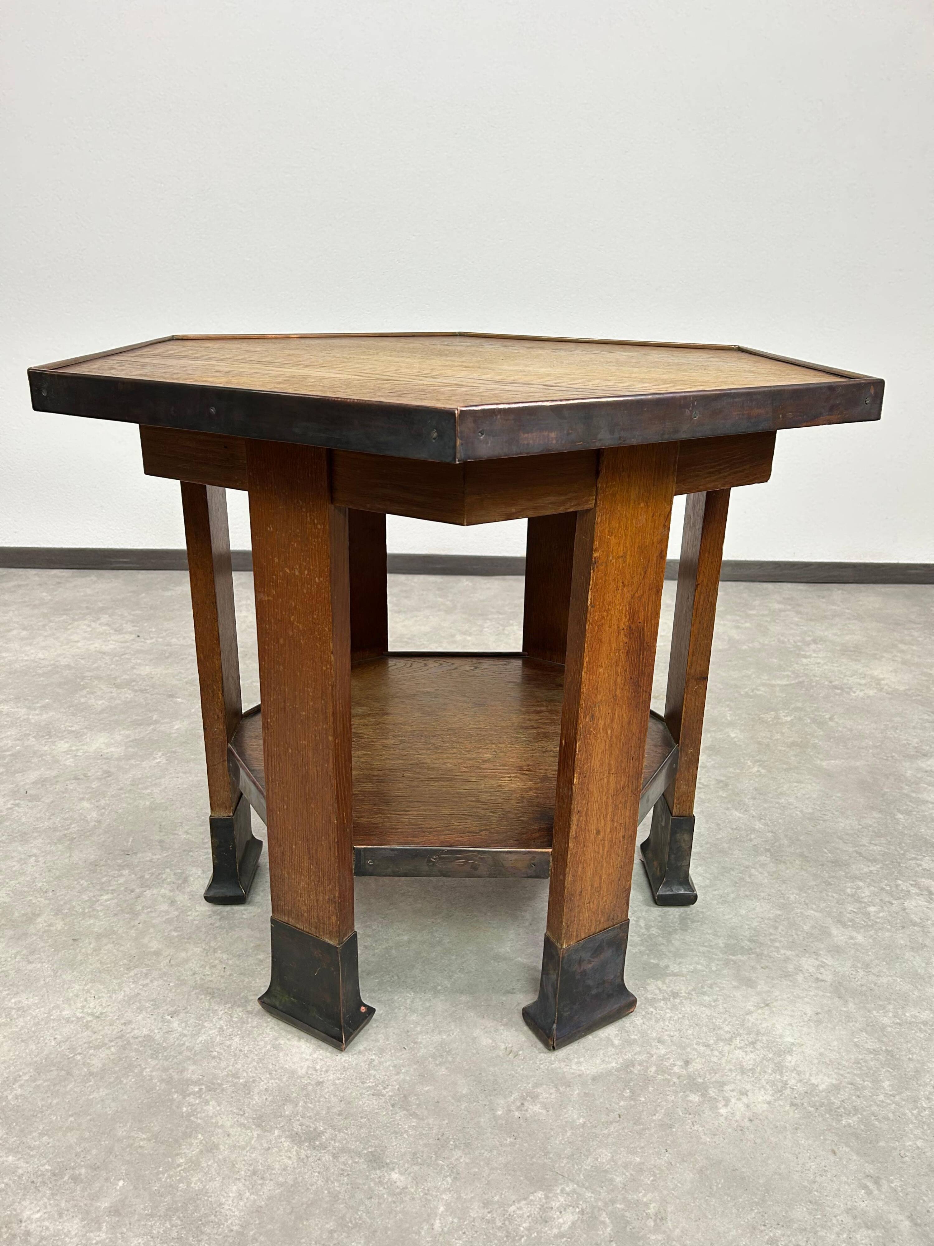 Hexagonal table with six legs in Secession style bordered with brass, attributed to Adolf Loos.