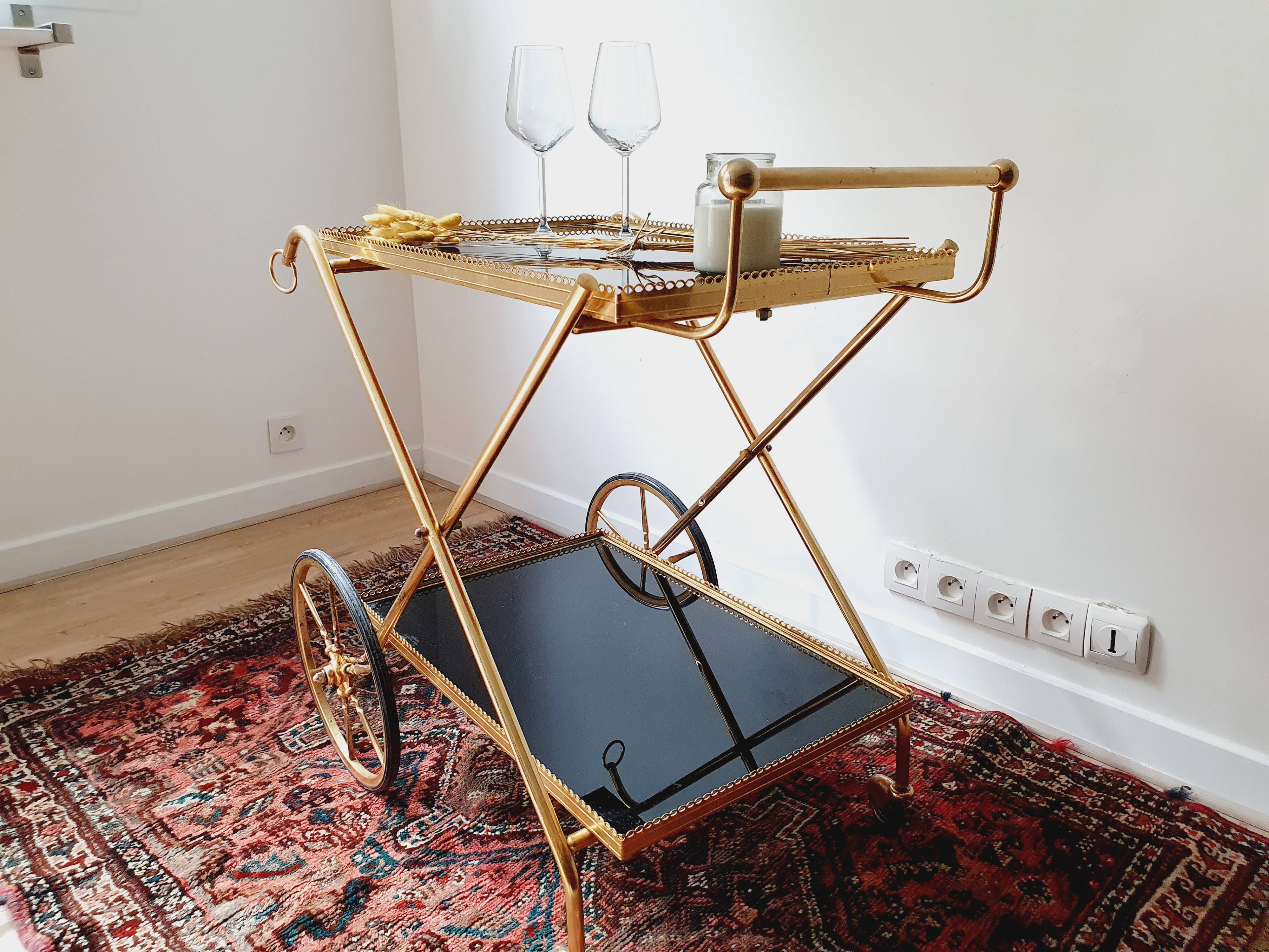 Vintage golden metal dessert on wheels