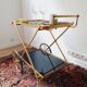Vintage golden metal dessert on wheels