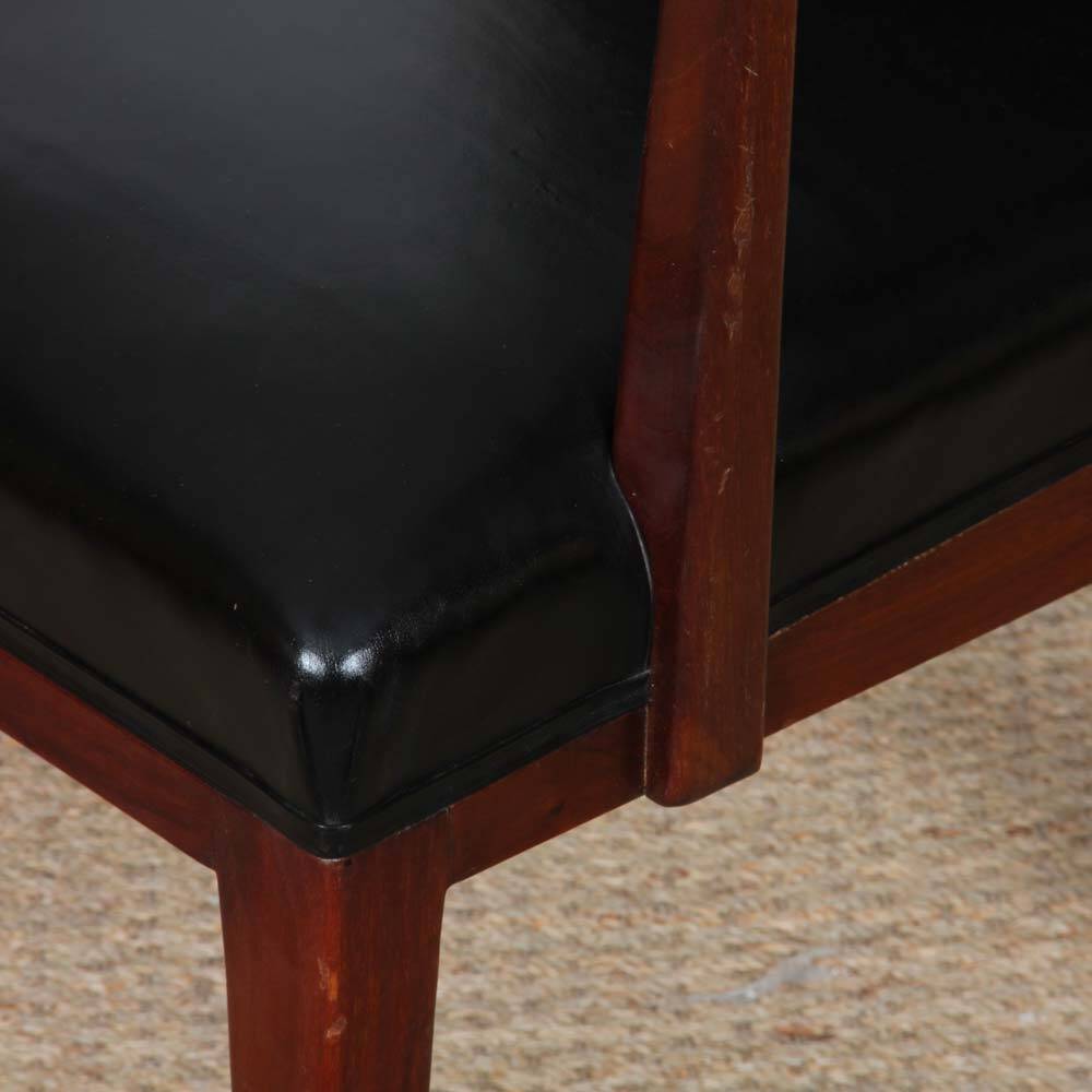 Pair of vintage wooden and leather armchairs from the 1950s.